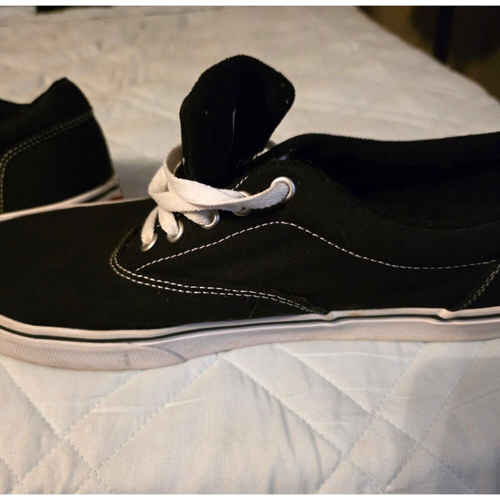 These are black Vans Authentic sneakers with white laces. - Picture 6 of 9